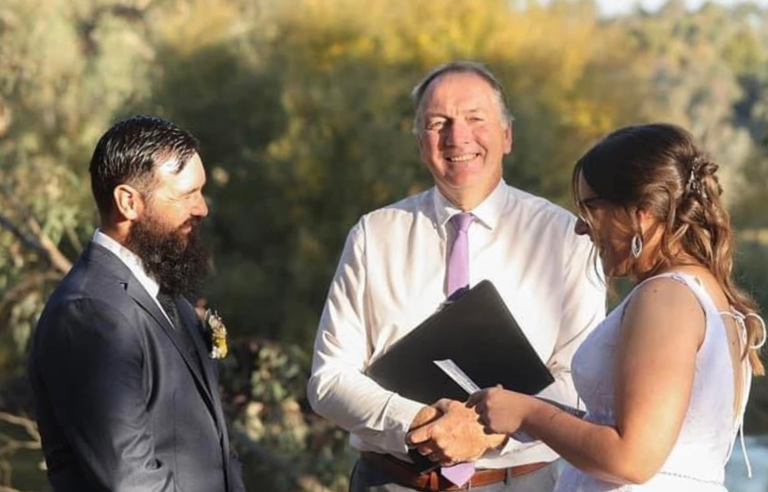 heartfelt outdoor wedding ceremony after exchanging vows [location]-murray river